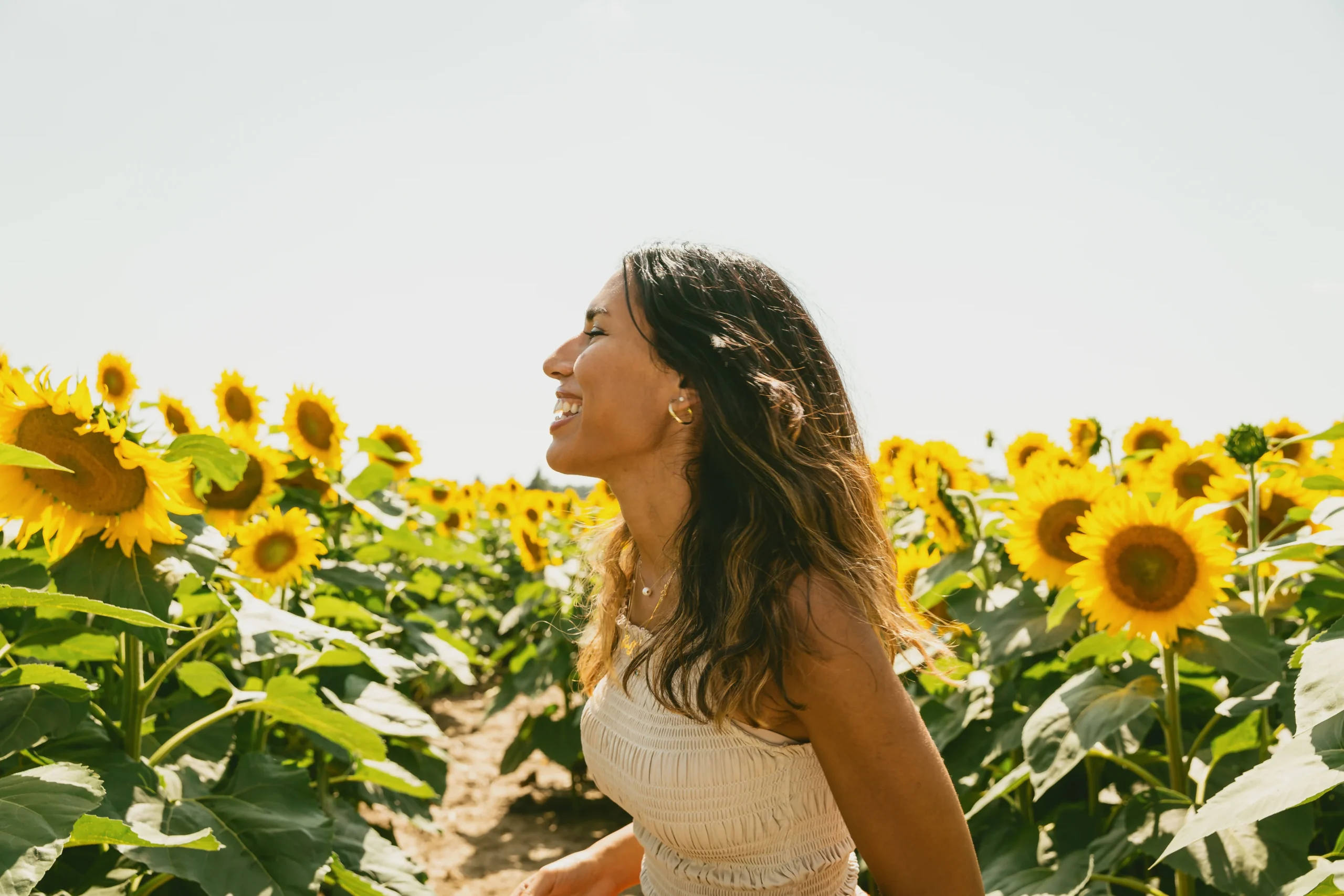 profile-of-a-person-smiling-in-a-sunflower-field
